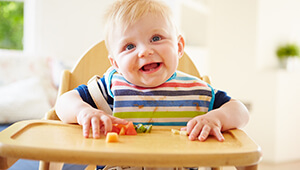 Smiling child at a table