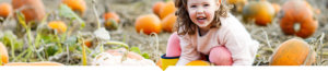 Child in pumpkin patch