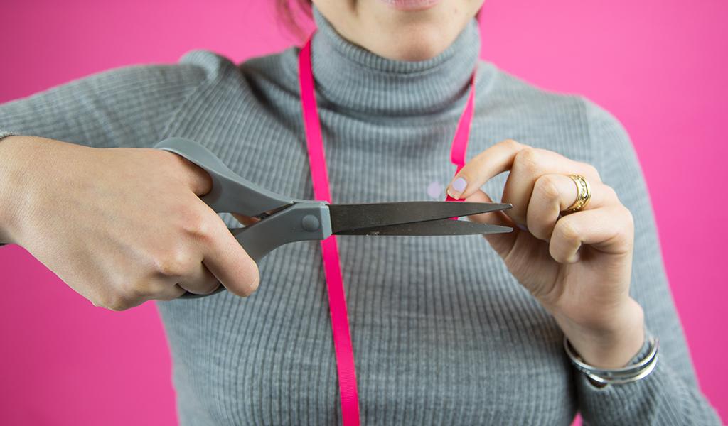 Woman cutting ribbon