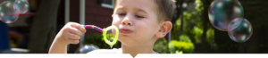 Kid blowing bubbles