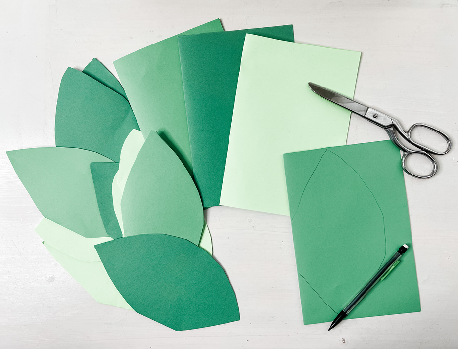 green construction paper cut into leaf shapes