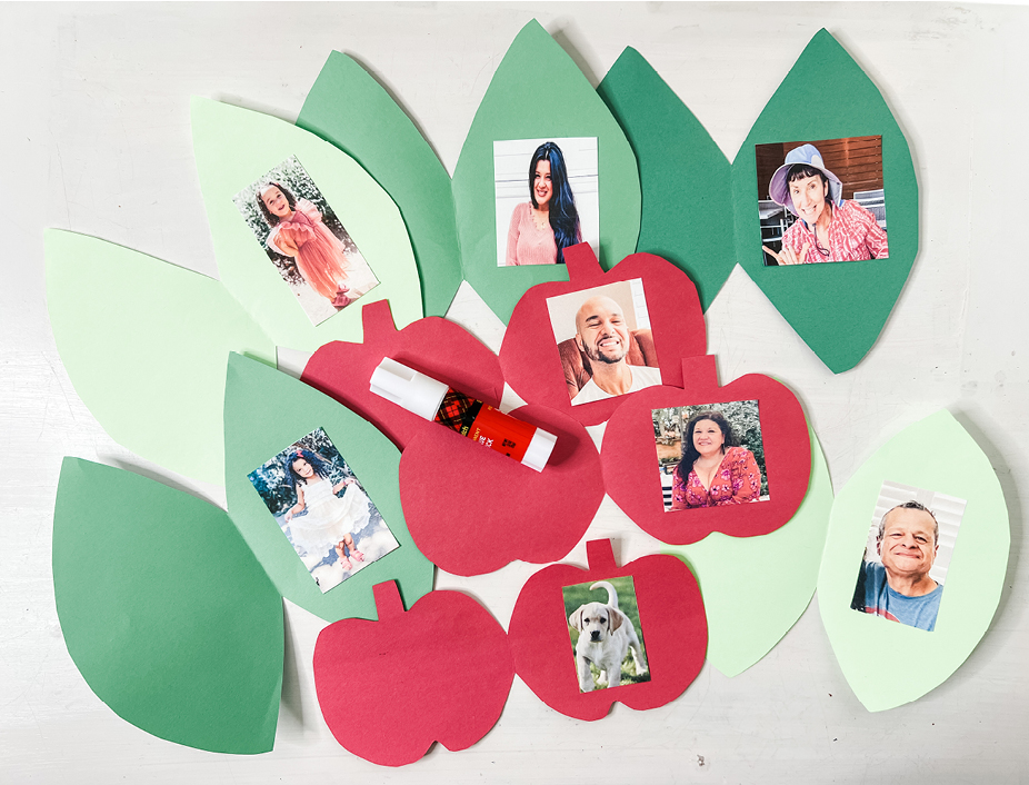 Pictures of family members glued to the construction paper apples and leaves.