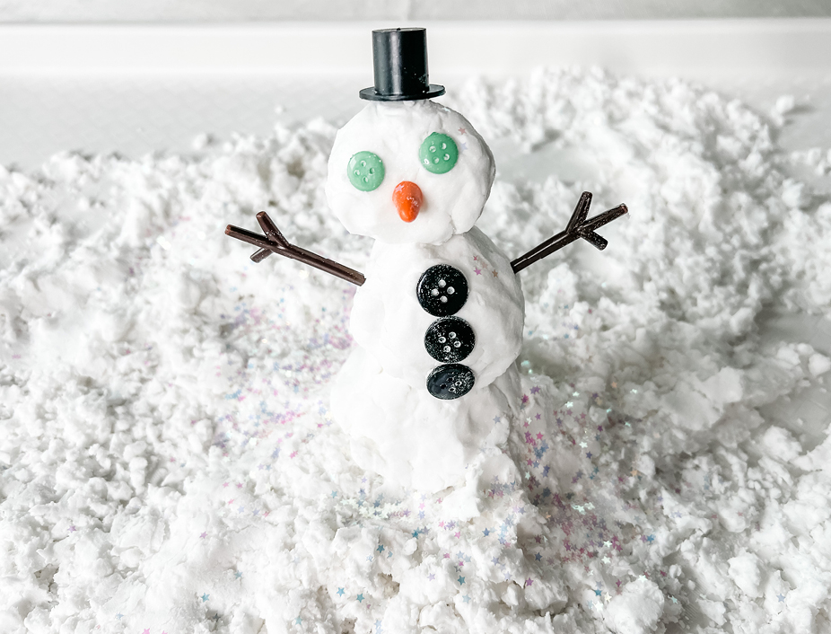 A cute snowman made with homemade snow