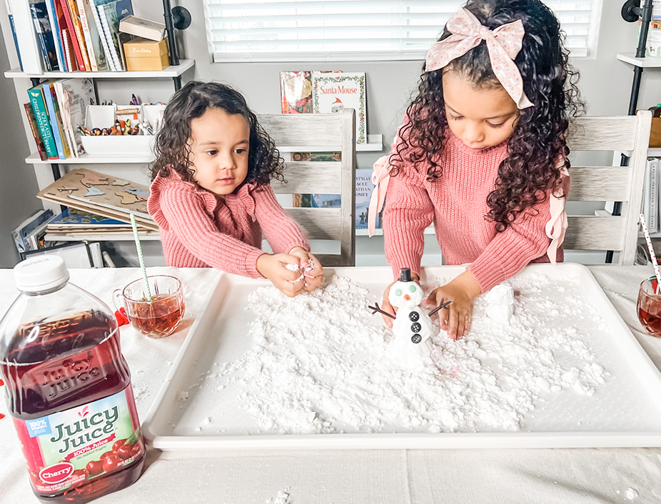 Young girls playing with the homemade snow