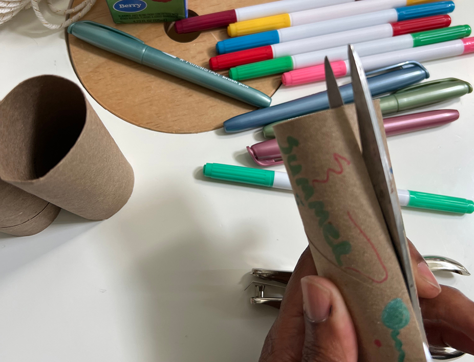 cutting the colored and designed paper roll