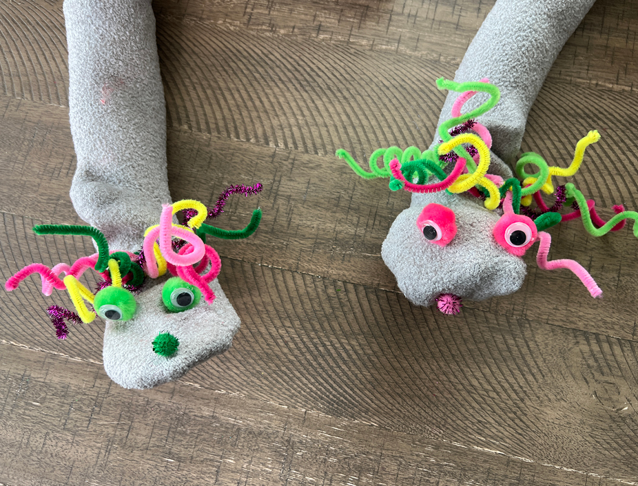 Bringing your sock puppet character to life: Decorating with eyes, nose, and hair, adding unique creative details. Ensure glue is fully dried before puppet play