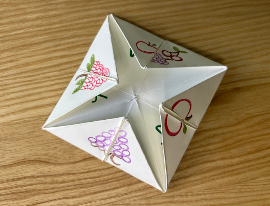 Decorated fortune teller with st. patricks day inspired art such as a post of gold and a clover. With clover stickers 